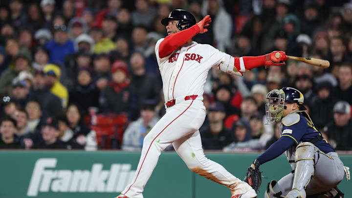 Apr 6, 2026; Boston, Massachusetts, USA; Boston Red Sox catcher Willson Contreras (40) hits an RBI double during the fourth inning against the Milwaukee Brewers at Fenway Park. Mandatory Credit: Paul Rutherford-Imagn Images