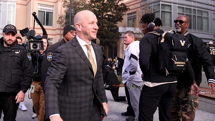 Nov 30, 2024; Nashville, Tennessee, USA; Vanderbilt Commodores head coach Clark Lea walks into the stadium prior to the start of the game against the Tennessee Volunteers  at FirstBank Stadium. Mandatory Credit: Steve Roberts-Imagn Images