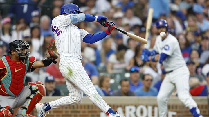 Apr 18, 2025; Chicago, Illinois, USA; Chicago Cubs center fielder Pete Crow-Armstrong (4) singles against the Arizona Diamondbacks during the seventh inning at Wrigley Field.