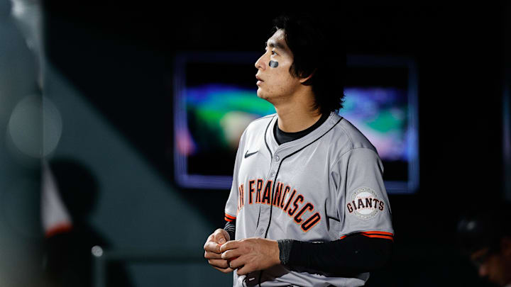 May 7, 2024; Denver, Colorado, USA; San Francisco Giants center fielder Jung Hoo Lee (51) looks on from the dugout in the seventh inning against the Colorado Rockies at Coors Field. May 7, 2024; Denver, Colorado, USA; San Francisco Giants center fielder Jung Hoo Lee (51) looks on from the dugout in the seventh inning against the Colorado Rockies at Coors Field.
