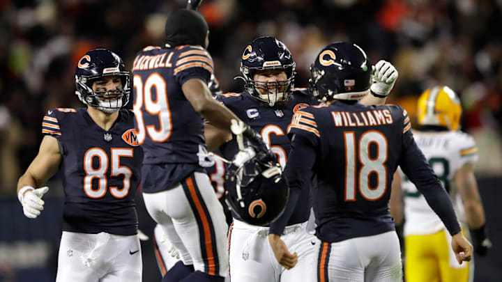 Bears quarterback Caleb Williams is swarmed by teammates after throwing the game-winning touchdown pass in overtime against Green Bay in Week 16. Bears quarterback Caleb Williams is swarmed by teammates after throwing the game-winning touchdown pass in overtime against Green Bay in Week 16.