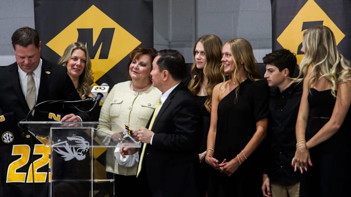 Holding a Mizzou jersey gifted by the UM System President, new Missouri athletic director Laird Veatch stands on stage with his family during a press conference at Stephens Indoor Facility on April 26, 2024 in Columbia, Mo.