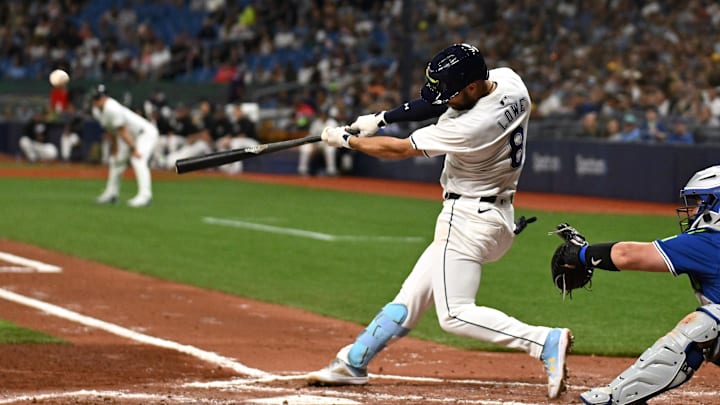 Mar 29, 2024; St. Petersburg, Florida, USA; Tampa Bay Rays second baseman Brandon Lowe (8) records a hit.