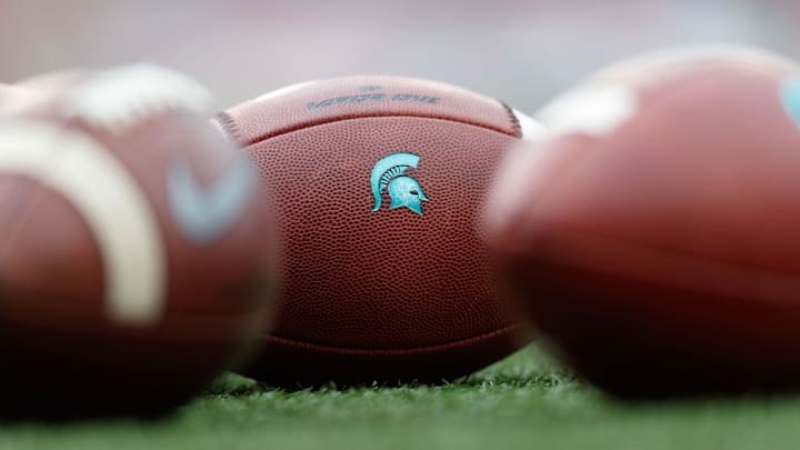 Oct 12, 2019; Madison, WI, USA; Michigan State Spartans logo on footballs during warmups prior to the game against the Wisconsin Badgers at Camp Randall Stadium. Mandatory Credit: Jeff Hanisch-USA TODAY Sports