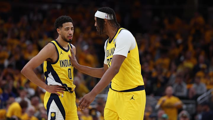 Indiana Pacers guard Tyrese Haliburton (0) and former center Myles Turner (33) talk during the third quarter of game three of the eastern conference finals for the 2025 NBA Playoffs.