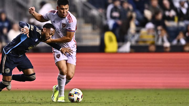 May 11, 2024; Philadelphia, Pennsylvania, USA; Orlando City midfielder Cesar Araujo (5) plays the ball defended by Philadelphia Union midfielder Jose Andres Martinez (8) at Subaru Park. Mandatory Credit: Kyle Ross-USA TODAY Sports