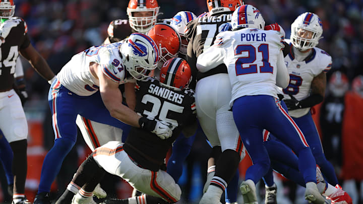 Cleveland Browns running back Raheim Sanders is tackled by Buffalo Bills defensive end Joey Bosa.