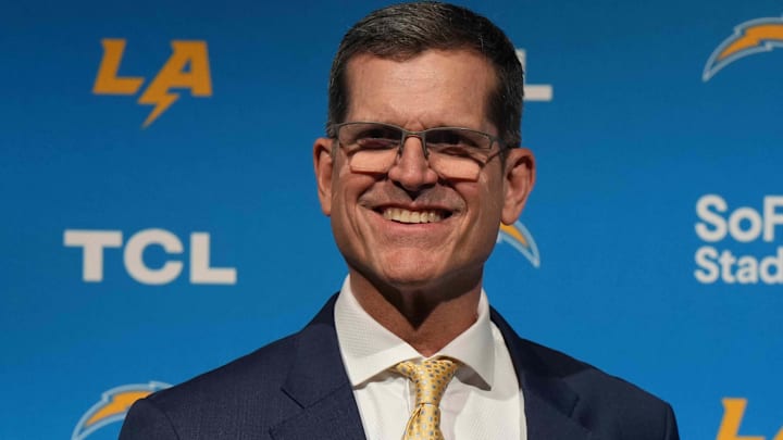 Feb 1, 2024; Inglewood, CA, USA; Los Angeles Chargers coach Jim Harbaugh poses with helmet at