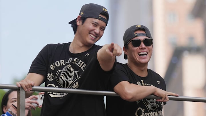 Nov 3, 2025; Los Angeles, CA, USA;  Los Angeles Dodgers two-way player Shohei Ohtani (17) and pitcher Yoshinobu Yamamoto (18) during the World Series championship parade and celebration. Mandatory Credit: Kirby Lee-Imagn Images