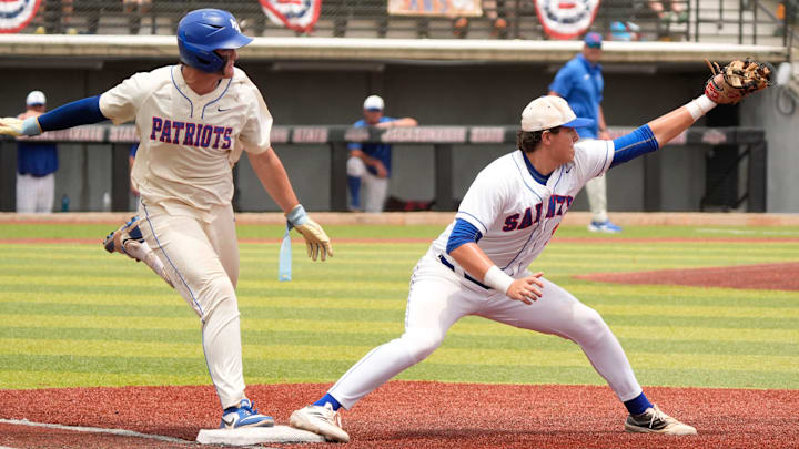May 16, 2025; Tuscaloosa, AL, USA; ACA's Hunter Elmore (27) is ruled out at first on a bang-bang play at Jacksonville State University. ACA came from four runs down to win 7-5 and claim the 5A AHSAA baseball championship.