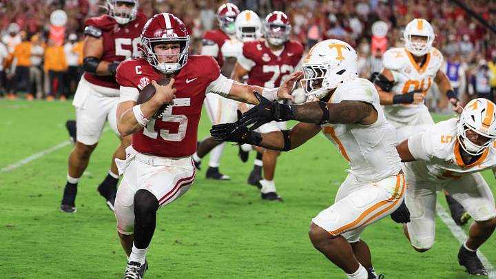 Oct 18, 2025; Tuscaloosa, Alabama, USA; Alabama Crimson Tide quarterback Ty Simpson (15) is forced out of bounds by Tennessee Volunteers linebacker Arion Carter (7) in he fourth quarter at Saban Field at Bryant-Denny Stadium. Mandatory Credit: David Leong-Imagn Images