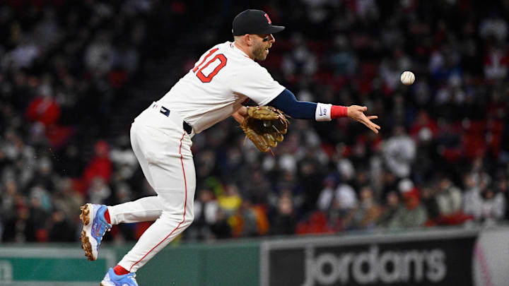 Apr 7, 2026; Boston, Massachusetts, USA; Boston Red Sox shortstop Trevor Story (10) tosses the ball to first base during the third inning against the Milwaukee Brewers at Fenway Park. Mandatory Credit: Eric Canha-Imagn Images