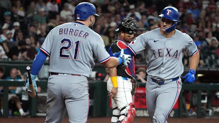 Texas Rangers left fielder Wyatt Langford celebrates with first baseman Jake Burger after hitting a solo home run. Credit: Rick Scuteri-Imagn Images Texas Rangers left fielder Wyatt Langford celebrates with first baseman Jake Burger after hitting a solo home run. Credit: Rick Scuteri-Imagn Images