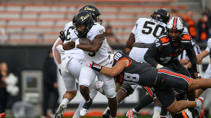 Oct 11, 2025; Corvallis, Oregon, USA; Wake Forest Demon Deacons running back Jamario Clements (3) runs the ball and is tackled by Oregon State Beavers linebacker Andy Alfieri (88) during the second half at Reser Stadium. Mandatory Credit: Craig Strobeck-Imagn Images
