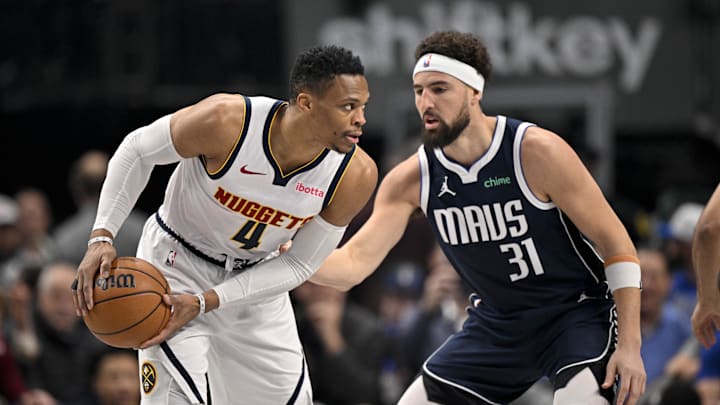 Jan 12, 2025; Dallas, Texas, USA; Denver Nuggets guard Russell Westbrook (4) looks to moves the ball past Dallas Mavericks guard Klay Thompson (31) during the first quarter at the American Airlines Center. Jan 12, 2025; Dallas, Texas, USA; Denver Nuggets guard Russell Westbrook (4) looks to moves the ball past Dallas Mavericks guard Klay Thompson (31) during the first quarter at the American Airlines Center.