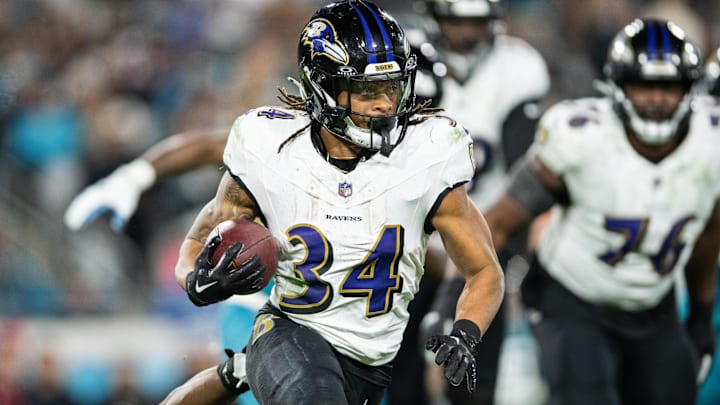 Dec 17, 2023; Jacksonville, Florida, USA; Baltimore Ravens running back Keaton Mitchell (34) runs the ball against the Jacksonville Jaguars in the fourth quarter at EverBank Stadium. Mandatory Credit: Jeremy Reper-Imagn Images