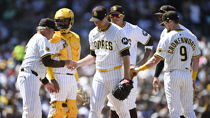 Mar 27, 2025; San Diego, California, USA; San Diego Padres starting pitcher Michael King (34), center, leaves the game during the third inning of a baseball game against the Atlanta Braves at Petco Park. Mandatory Credit: Denis Poroy-Imagn Images Mar 27, 2025; San Diego, California, USA; San Diego Padres starting pitcher Michael King (34), center, leaves the game during the third inning of a baseball game against the Atlanta Braves at Petco Park. Mandatory Credit: Denis Poroy-Imagn Images