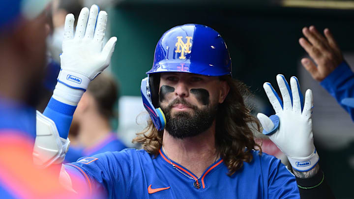 May 4, 2025; St. Louis, Missouri, USA; New York Mets outfielder Jesse Winker (3) is congratulated in the dugout after hitting a sacrifice fly to left, scoring teammate Juan Soto (not shown) against the St. Louis Cardinals at Busch Stadium. Mandatory Credit: Tim Vizer-Imagn Images