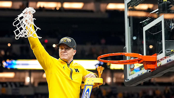Dusty May and the Wolverines cut down the nets as national champions.