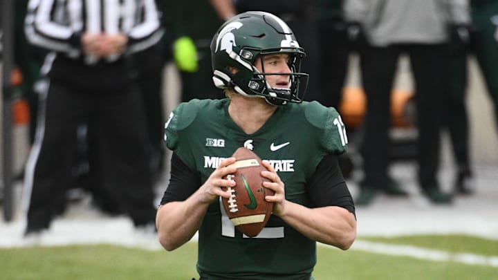 Dec 5, 2020; East Lansing, Michigan, USA; Michigan State Spartans quarterback Rocky Lombardi (12) looks to pass during the first quarter against the Ohio State Buckeyes at Spartan Stadium. Mandatory Credit: Tim Fuller-Imagn Images Dec 5, 2020; East Lansing, Michigan, USA; Michigan State Spartans quarterback Rocky Lombardi (12) looks to pass during the first quarter against the Ohio State Buckeyes at Spartan Stadium. Mandatory Credit: Tim Fuller-Imagn Images