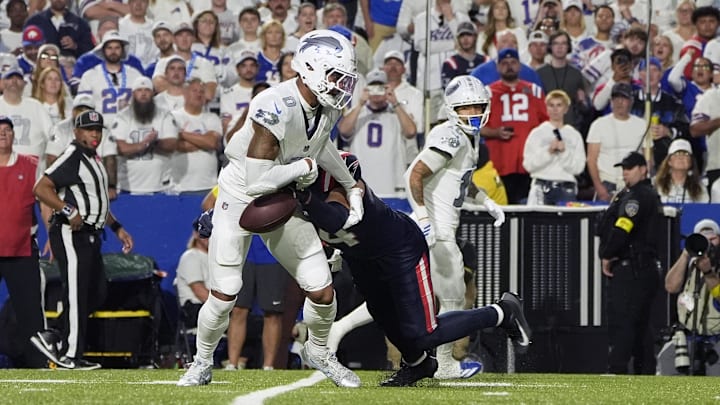 Oct 5, 2025; Orchard Park, New York, USA; Buffalo Bills wide receiver Keon Coleman (0) makes a catch and then fumbles the ball against the New England Patriots Oct 5, 2025; Orchard Park, New York, USA; Buffalo Bills wide receiver Keon Coleman (0) makes a catch and then fumbles the ball against the New England Patriots