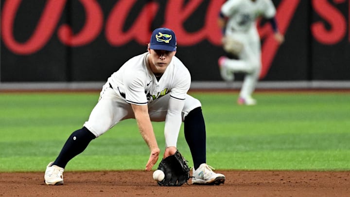 Aug 9, 2024; St. Petersburg, Florida, USA; Tampa Bay Rays shortstop Taylor Walls (6) fields a ground ball in the fifth inning against the Baltimore Orioles  at Tropicana Field.