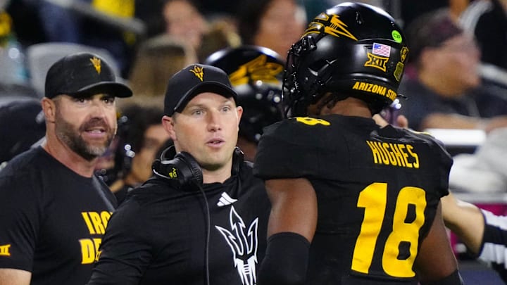 Arizona State head coach Kenny Dillingham greets linebacker Martell Hughes (18) during a game at Mountain America Stadium in Tempe on Sept. 26, 2025.