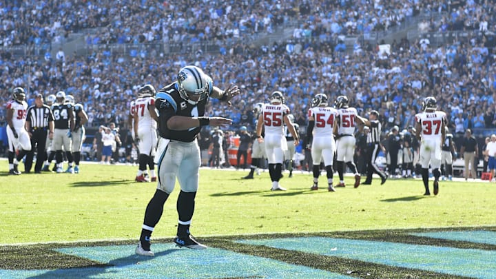 Dec 13, 2015; Charlotte, NC, USA; Carolina Panthers quarterback Cam Newton (1) does the dab dance after the Panthers score a touchdown in the first quarter at Bank of America Stadium. Mandatory Credit: Bob Donnan-Imagn Images
