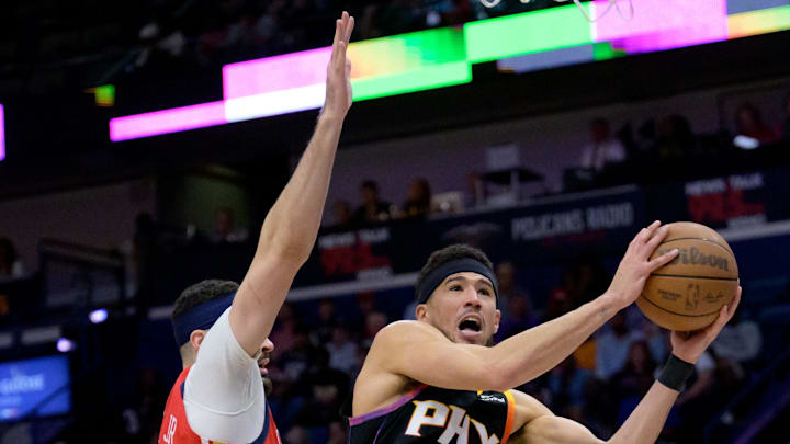 Apr 1, 2024; New Orleans, Louisiana, USA; Phoenix Suns guard Devin Booker (1) shoots against New
