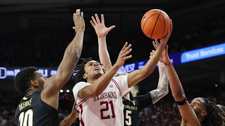 Jan 20, 2026; Fayetteville, Arkansas, USA; Arkansas Razorbacks guard D.J. Wagner (21) drives to the basket during the first half against the Vanderbilt Commodores at Bud Walton Arena. Mandatory Credit: Nelson Chenault-Imagn Images
