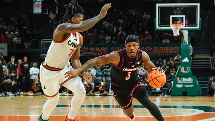 Mar 7, 2026; Coral Gables, Florida, USA; Louisville Cardinals guard Ryan Conwell (3) dribbles the ball against Miami Hurricanes forward Shelton Henderson (7) at Watsco Center. Mandatory Credit: Jeff Romance-Imagn Images