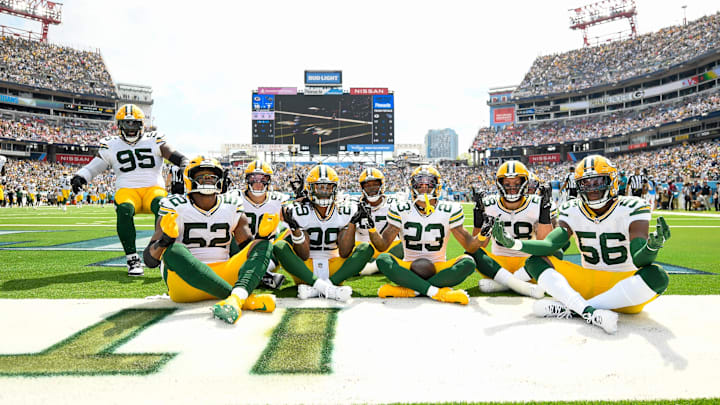 Green Bay Packers cornerback Jaire Alexander (23) celebrates his pick-six with teammates at Tennessee on Sunday.