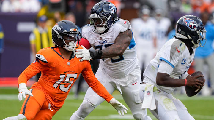 September 7, 2025: Denver Broncos linebacker Nik Bonitto (15) is held by Tennessee Titans offensive tackle Dan Moore Jr. (75) in the second half of the football game between the Denver Broncos and Tennessee Titans. September 7, 2025: Denver Broncos linebacker Nik Bonitto (15) is held by Tennessee Titans offensive tackle Dan Moore Jr. (75) in the second half of the football game between the Denver Broncos and Tennessee Titans.