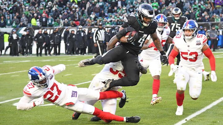Jan 5, 2025; Philadelphia, Pennsylvania, USA; New York Giants safety Jason Pinnock (27) and linebacker Boogie Basham (55) stop Philadelphia Eagles running back Kenneth Gainwell (14) during the fourth quarter at Lincoln Financial Field. Mandatory Credit: Eric Hartline-Imagn Images