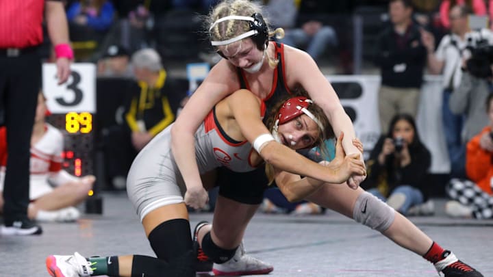 Ottumwa's Jasmine Luedtke wrestles Cedar Falls' Lauren Whitt in a semi-final match at the IGHSAU girls state wrestling tournament Friday, Feb. 2, 2024 at Xtream Arena in Coralville.