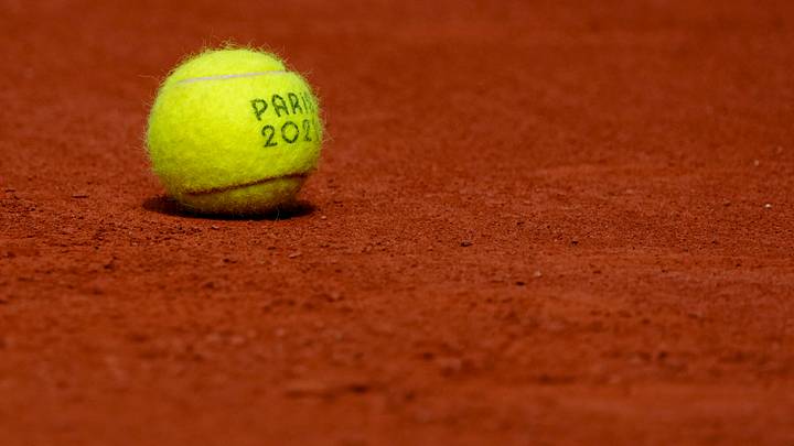 A tennis ball sits on the clay courts during the Paris 2024 Olympic Summer Games at Stade Roland Garros. Mandatory Credit: Kirby Lee-USA TODAY Sports A tennis ball sits on the clay courts during the Paris 2024 Olympic Summer Games at Stade Roland Garros. Mandatory Credit: Kirby Lee-USA TODAY Sports