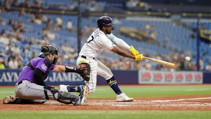 St. Petersburg, Florida, USA;  Tampa Bay Rays shortstop Osleivis Basabe (37) hits an RBI single against the Colorado Rockies in the fourth inning at Tropicana Field.