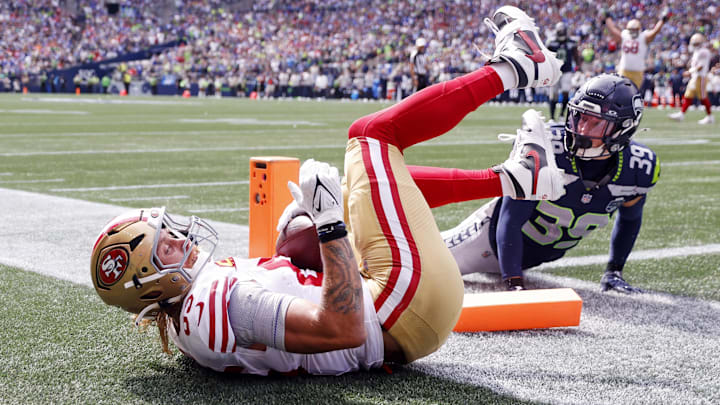 Sep 7, 2025; Seattle, Washington, USA; San Francisco 49ers tight end George Kittle (85) celebrates after scoring a touchdown during the first half against the Seattle Seahawks during the first quarter at Lumen Field. Mandatory Credit: Joe Nicholson-Imagn Images