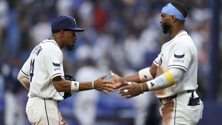 Apr 6, 2026; St. Petersburg, Florida, USA; Tampa Bay Rays center fielder Chandler Simpson (14) and designated hitter Yandy Diaz (2) react after beating the Chicago Cubs at Tropicana Field.