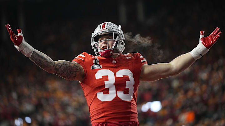 Ohio State Buckeyes defensive end Jack Sawyer (33) celebrates a sack of Tennessee Volunteers quarterback Nico Iamaleava (8) during the first half of the College Football Playoff first round game at Ohio Stadium in Columbus on Dec. 21, 2024.
