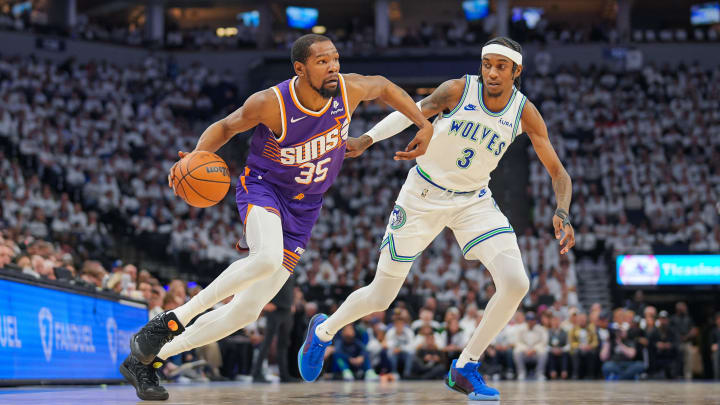 Apr 23, 2024; Minneapolis, Minnesota, USA; Phoenix Suns forward Kevin Durant (35) dribbles against