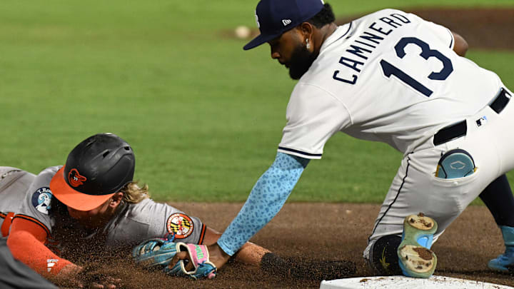 Baltimore's Jackson Holliday gets tagged out by Tampa Bay Rays third baseman Junior Caminero (13) on Tuesday night.