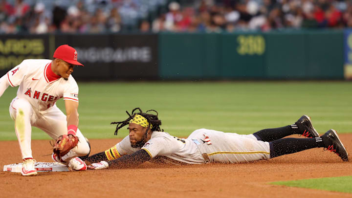 Apr 23, 2025; Anaheim, California, USA;  Pittsburgh Pirates center fielder Oneil Cruz (15) steals second base past the tag of Los Angeles Angels second baseman Kyren Paris (19) during the third inning at Angel Stadium. Mandatory Credit: Kiyoshi Mio-Imagn Images