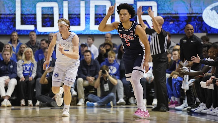 Jan 26, 2026; Provo, Utah, USA; Arizona Wildcats guard Brayden Burries (5) reacts to a three-pointer during the first half against the BYU Cougars at Marriott Center. Mandatory Credit: Aaron Baker-Imagn Images 