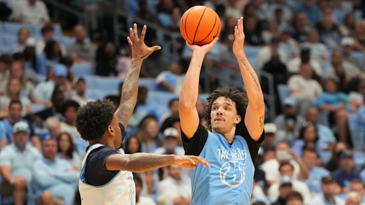 Oct 4, 2025; Charlotte, NC, USA; North Carolina Tar Heels forward Zayden High (1) shoots as guard Jaydon Young (4) defends in the second half at Dean E. Smith Center. Mandatory Credit: Bob Donnan-Imagn Images Oct 4, 2025; Charlotte, NC, USA; North Carolina Tar Heels forward Zayden High (1) shoots as guard Jaydon Young (4) defends in the second half at Dean E. Smith Center. Mandatory Credit: Bob Donnan-Imagn Images