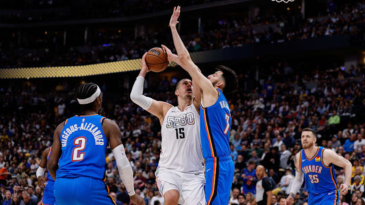 May 15, 2025; Denver, Colorado, USA; Denver Nuggets center Nikola Jokic (15) drives to the net against Oklahoma City Thunder forward Chet Holmgren (7) as guard Shai Gilgeous-Alexander (2) defends in the third quarter during game six of the second round for the 2025 NBA Playoffs at Ball Arena. Mandatory Credit: Isaiah J. Downing-Imagn Images May 15, 2025; Denver, Colorado, USA; Denver Nuggets center Nikola Jokic (15) drives to the net against Oklahoma City Thunder forward Chet Holmgren (7) as guard Shai Gilgeous-Alexander (2) defends in the third quarter during game six of the second round for the 2025 NBA Playoffs at Ball Arena. Mandatory Credit: Isaiah J. Downing-Imagn Images