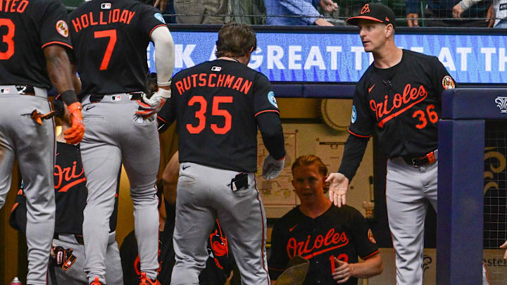 May 21, 2025; Milwaukee, Wisconsin, USA;  Baltimore Orioles catcher Adley Rutschman (35) is greeted by interim manager Tony Mansolino after hitting a 3-run home run in the eleventh inning against the Milwaukee Brewers at American Family Field. 