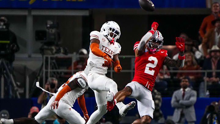 Ohio State receiver Emeka Egbuka has a catch broken up by Texas Longhorns defensive back Jahdae Barron.