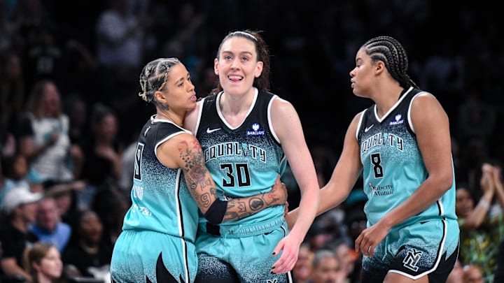 Jun 19, 2025; Brooklyn, New York, USA; New York Liberty forward Breanna Stewart (30) is greeted by guard Natasha Cloud (9) and center Nyara Sabally (8) after scoring s basket against the Phoenix Mercury during the second half at Barclays Center. Mandatory Credit: John Jones-Imagn Images