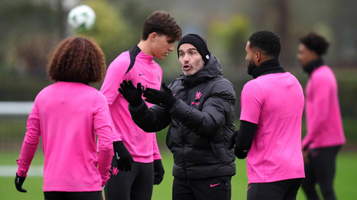 Enzo Maresca talking to Marc Cucurella during Chelsea training at Cobham. Enzo Maresca talking to Marc Cucurella during Chelsea training at Cobham.